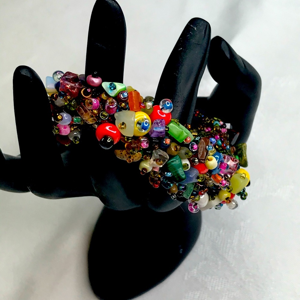 Boho beaded Bracelet. Multicolored beads with bead and loop closure